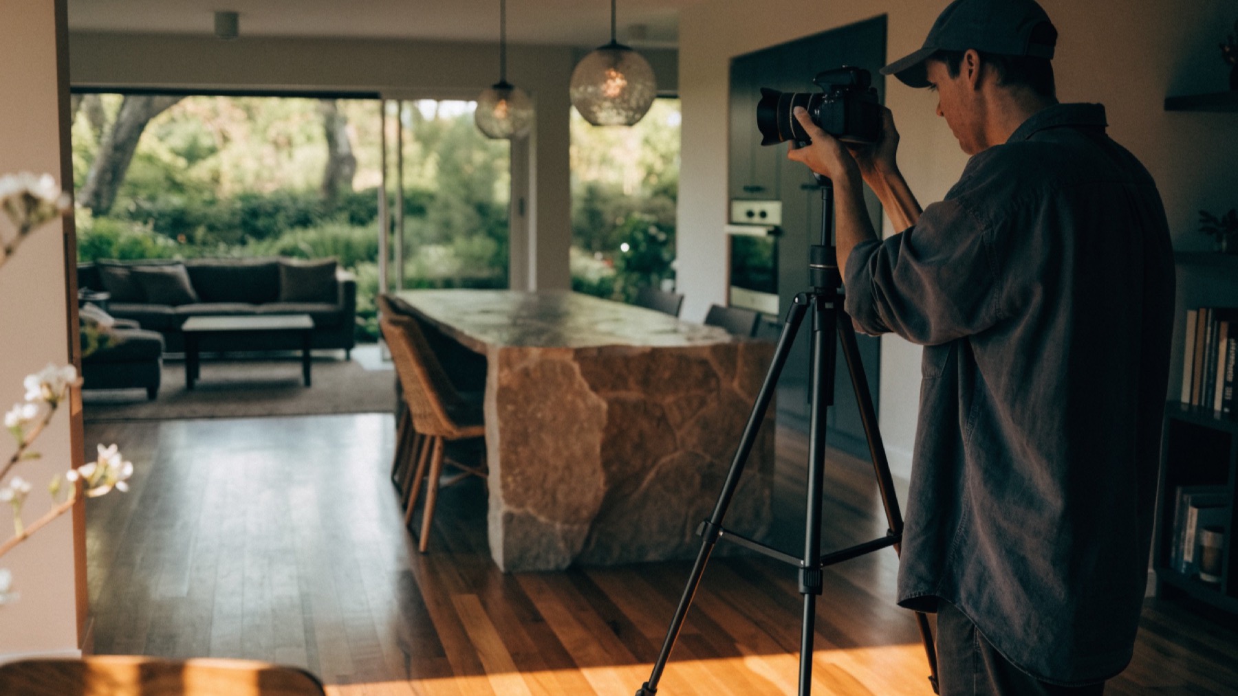 A property photographer shooting the open plan living area of an Australian home