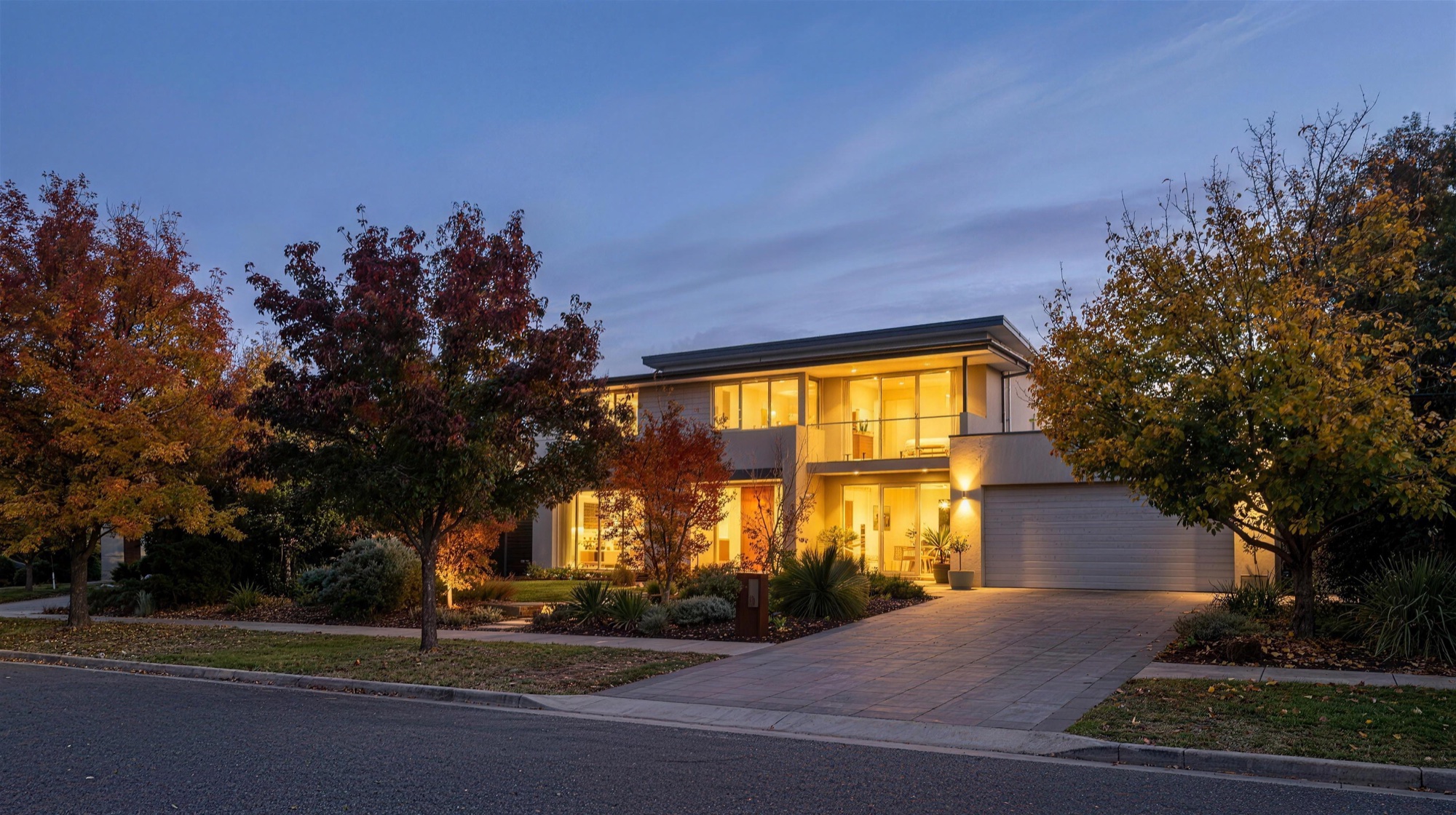 Contemporary Canberra home at dusk in autumn presented for a private sale